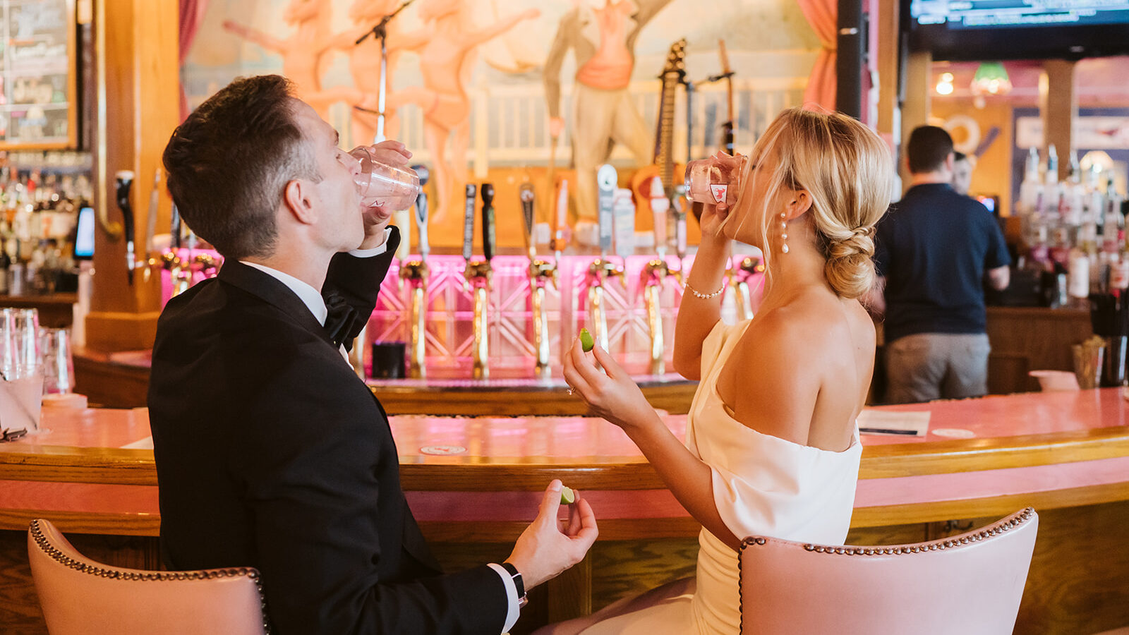 Mackinac Island Wedding at Mission Point, Bride and Groom take a break and sip on tequila at Pink Pony Restaurant